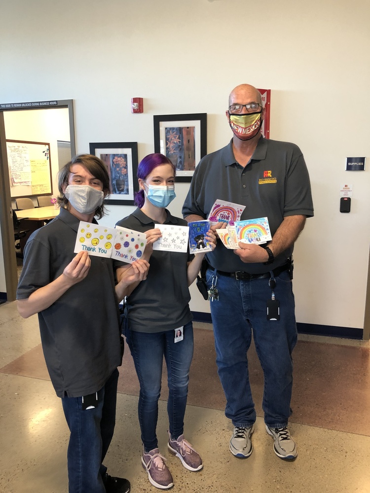 RRPS Custodians for Martin Luther King Jr Elementary School hold up their thank you cards