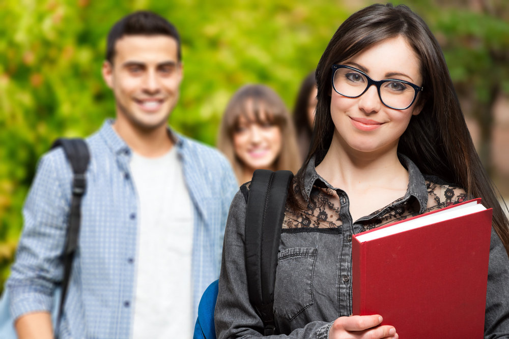 Image of high school students holding books