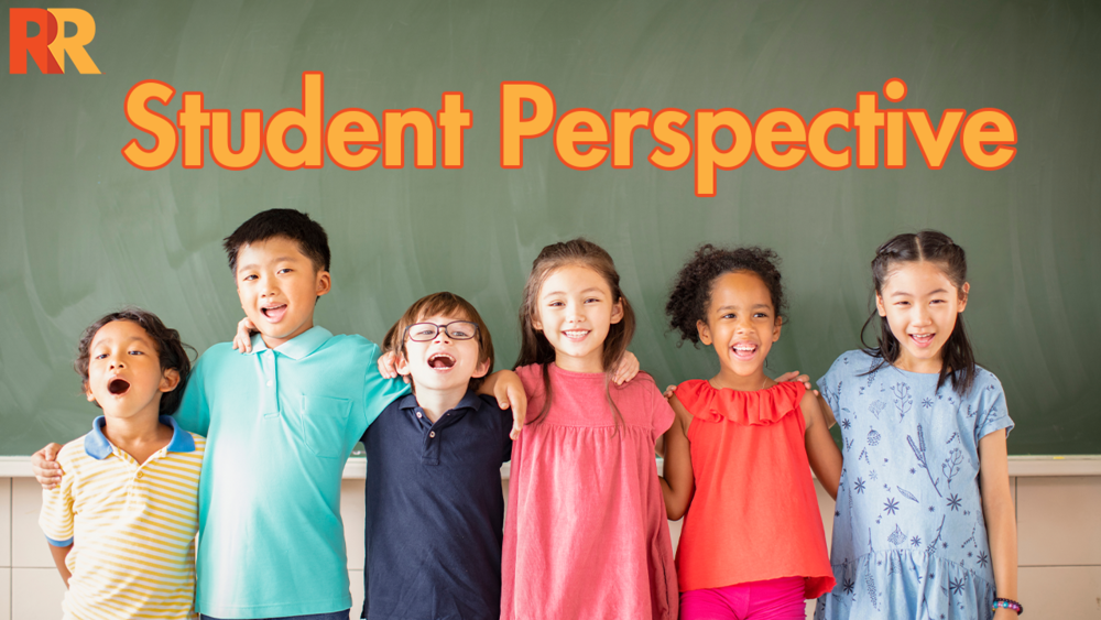 The Student Perspective with a group of elementary students lined up in a row smiling