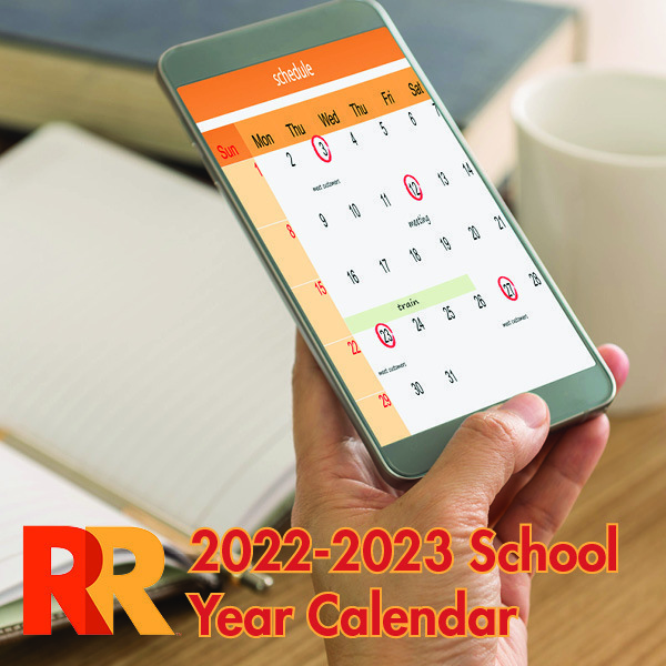 Photo of someone looking at a calendar on their cell phone with the words "2022-2023 School Year Calendar" written below the image.